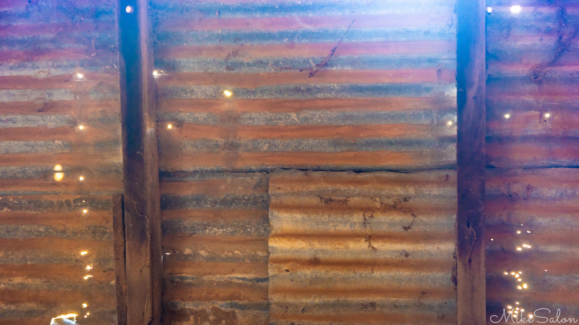 Walling at Yanga Woolshed. The nailholes imply extensive reuse of this sheeting. [4963]