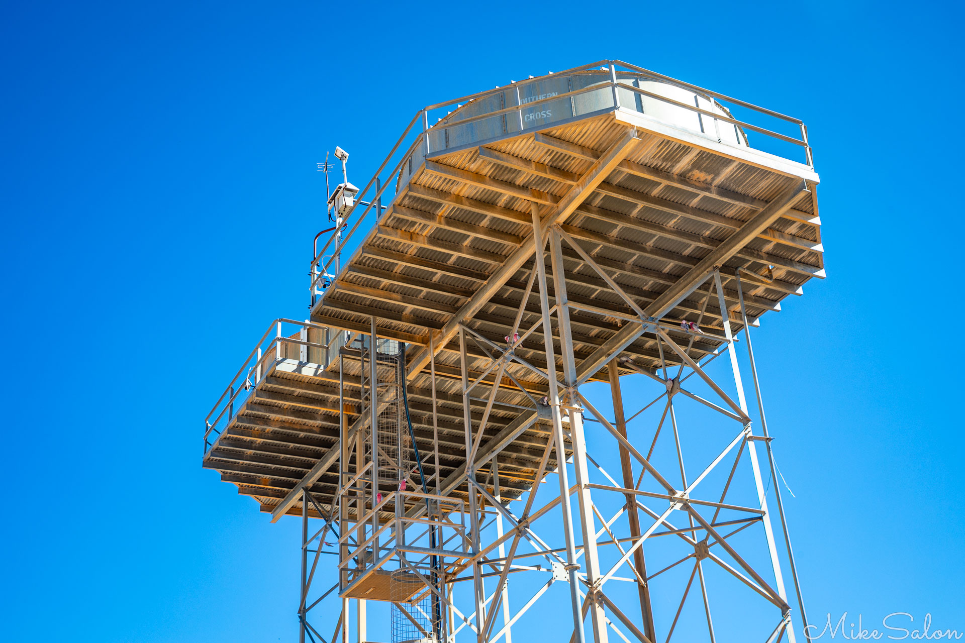 Two water tanks atop giant towers in Birdsville, with a brilliantly clear blue sky. [1053]