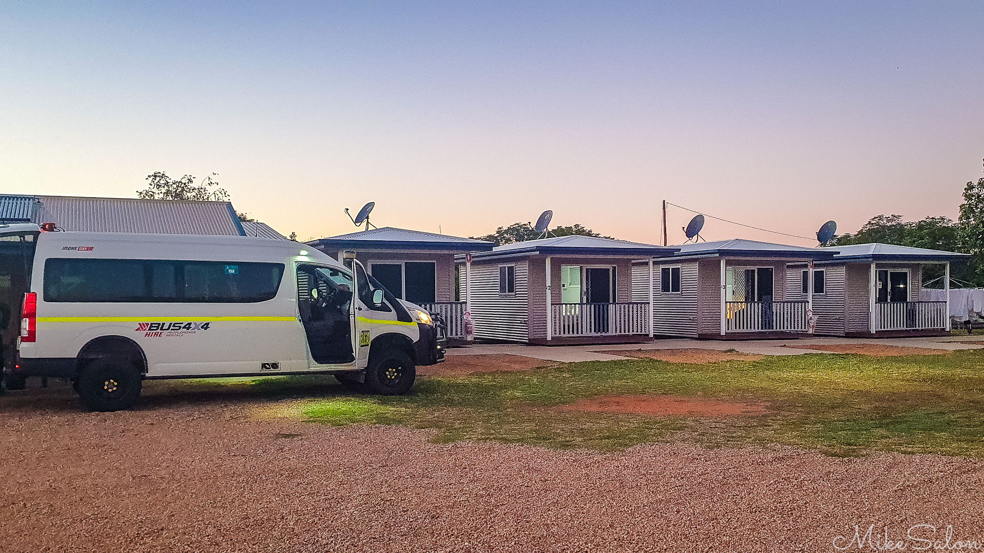 Four cabins and a small Tour Bus parked at Windorah. [5647]