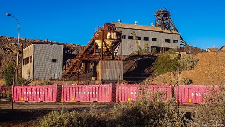 Pink shipping containers celebrate Charles Rasp`s contribution to Broken Hill. This may be the minehead of the still operating Rasp Mine. [0408]