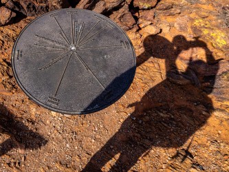 360 degree directional indicator at the top of the hill in the Broken Hill Living Desert Reserve, with Mike`s shadow. [2743]