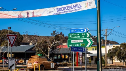 Westbound arrivals welcomed to Broken Hill, with a giant tailings heap overlooking the town. That car has been on the dirt road access. [3151]