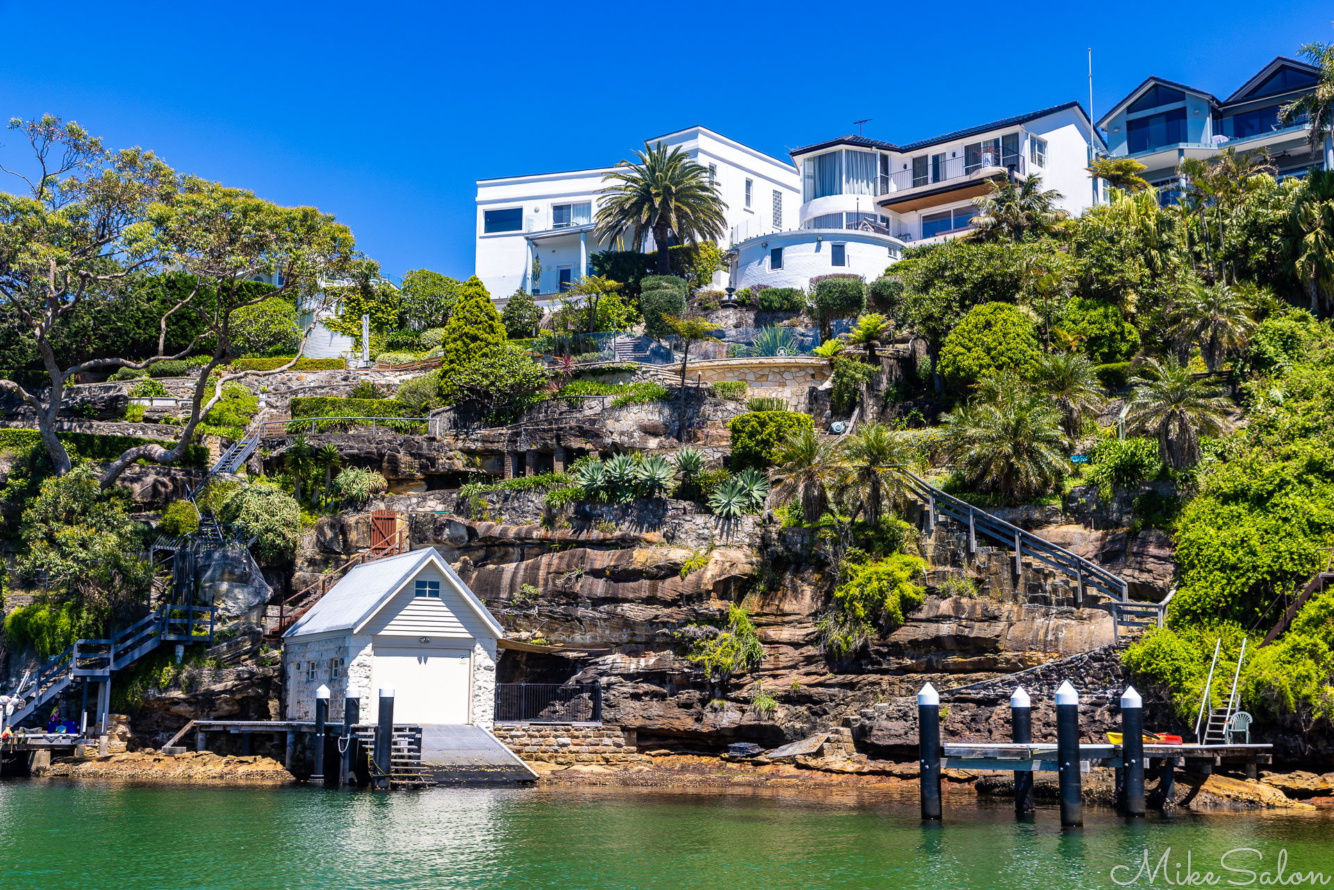 Burraneer house atop a cliff, and its boathouse. [6435]