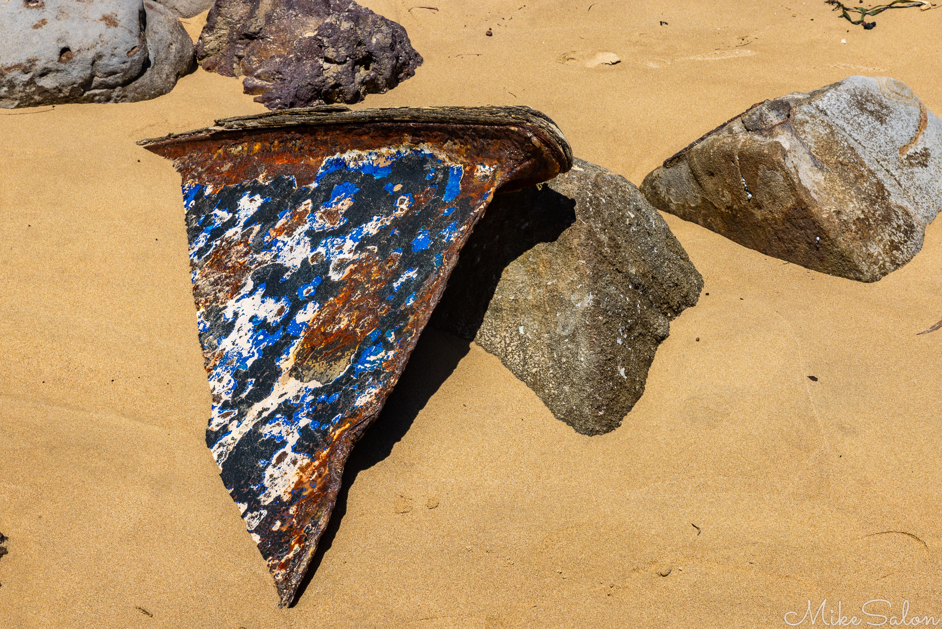 Metallic something washed up on Bundeena beach, maybe a mooring plate. [6445]
