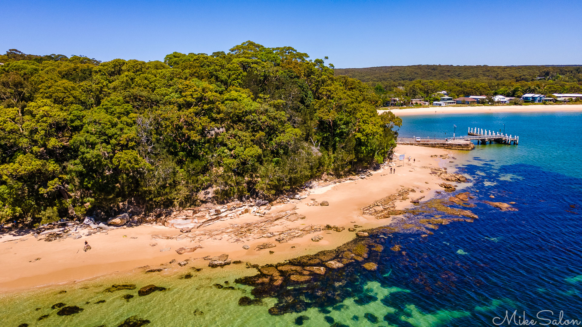 Aerial view of Bundeena Wharf with the beach and town in the background. [0139]