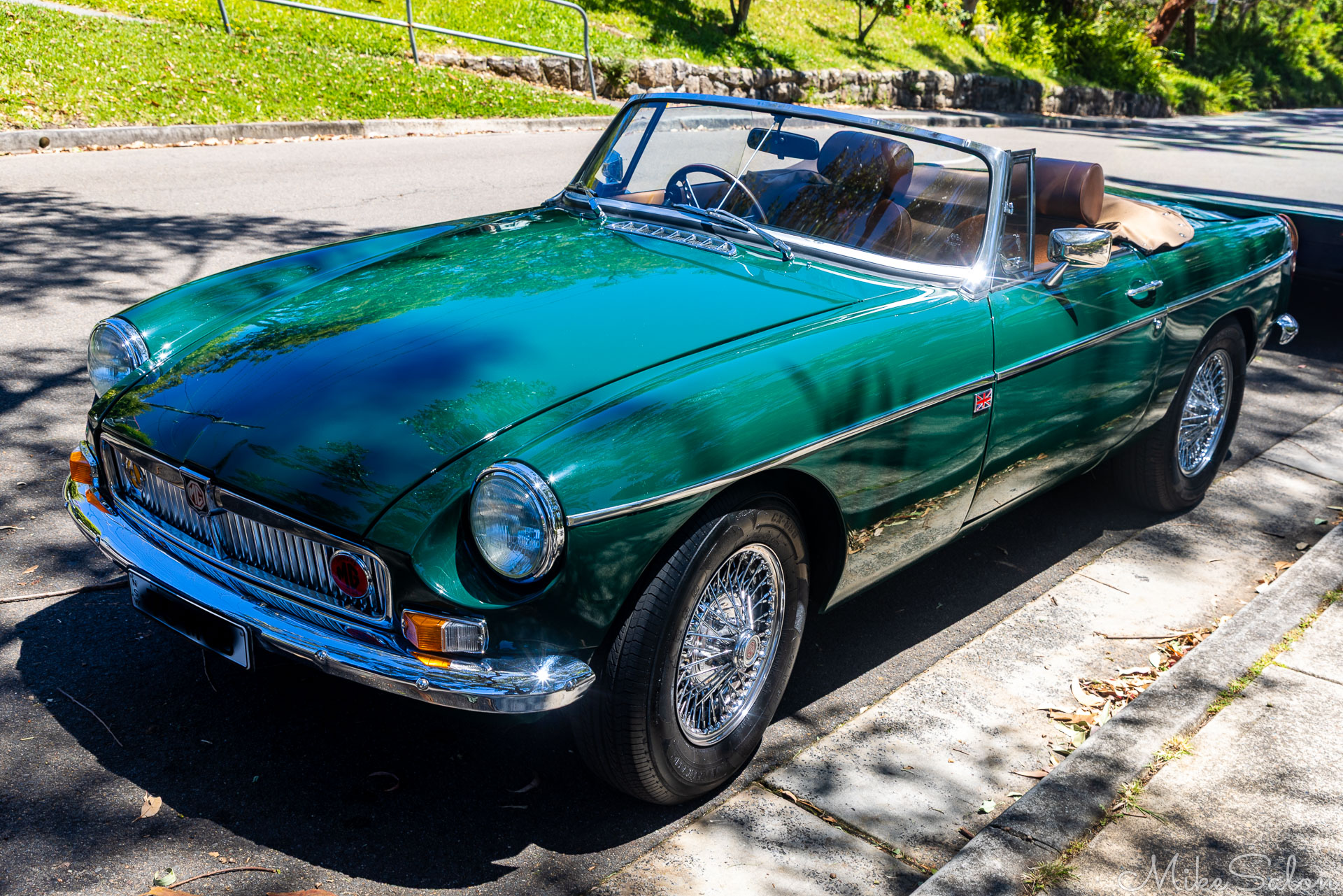 Old green MGB sports car on the streets of Bundeena. [6458]
