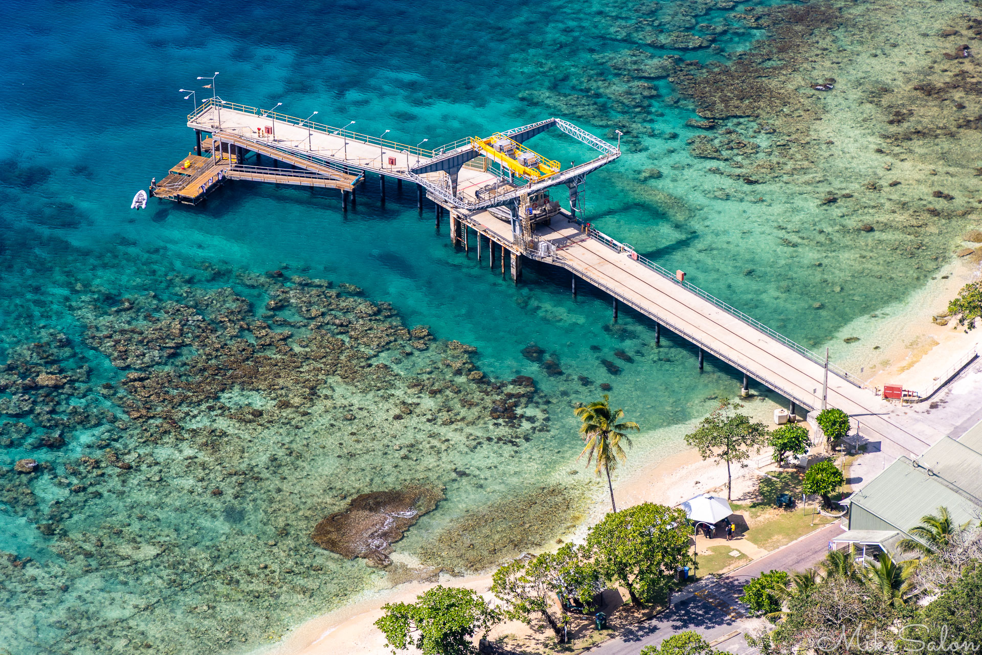Aerial view of the cargo wharf in Flying Fish Cove. [0078]