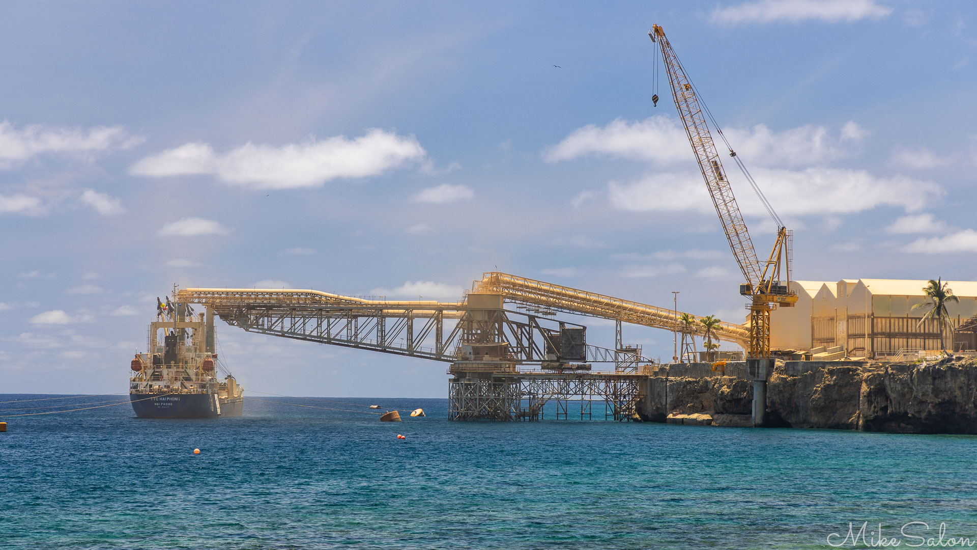 Phosphate ore being loaded onto a ship at Christmas Island Port. [0023]