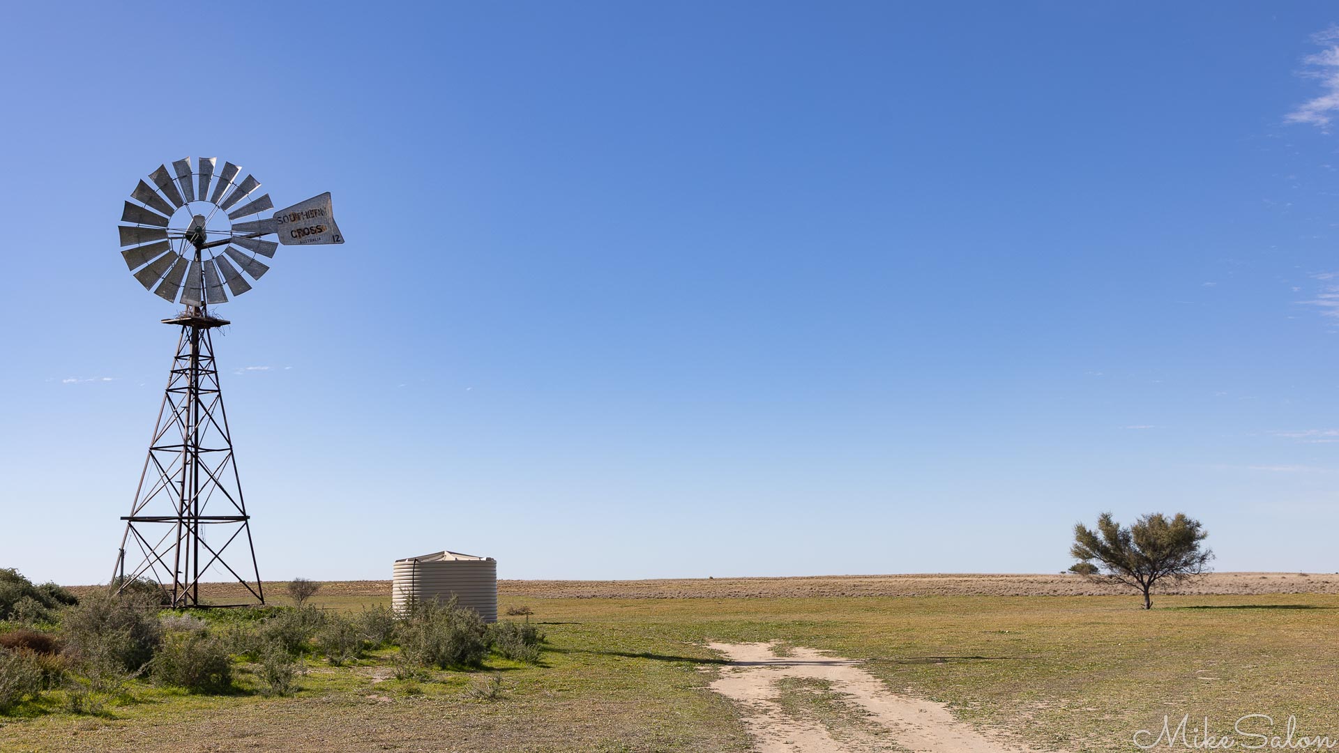 Water pumping windmill in an otherwise empty plain. [1978]