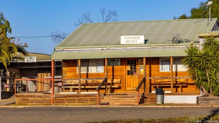 Rustic Ivanhoe Hotel from the front, with a For Sale sign. [2022]