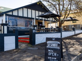 Exterior view of So Sando cafe, with advertising board. [3358]