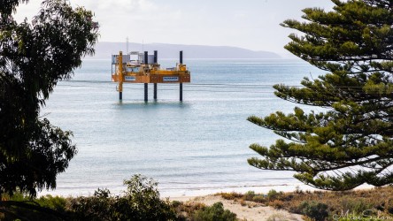 Over-water elevated platform for maintenance off a beach. [4422]