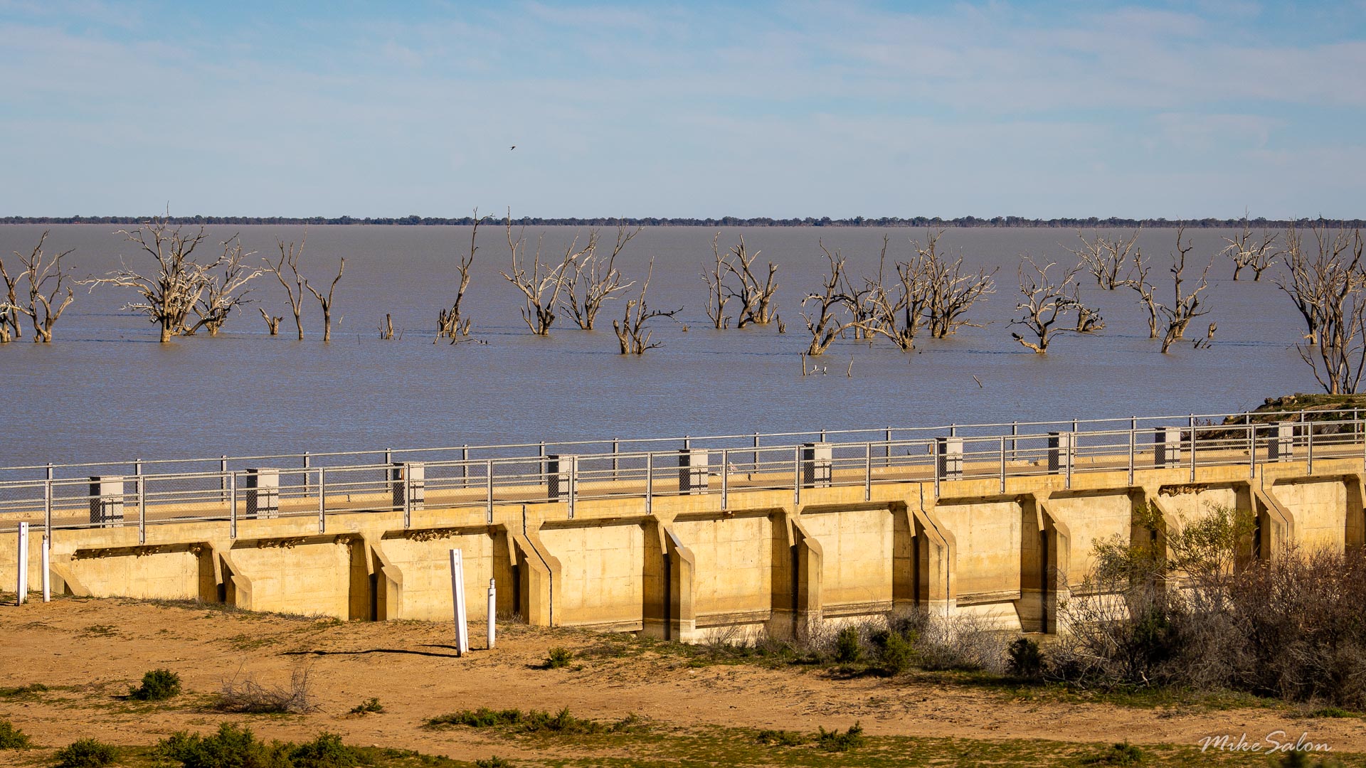 Concrete weir with submerged dead trees in the Menindee Lakes.