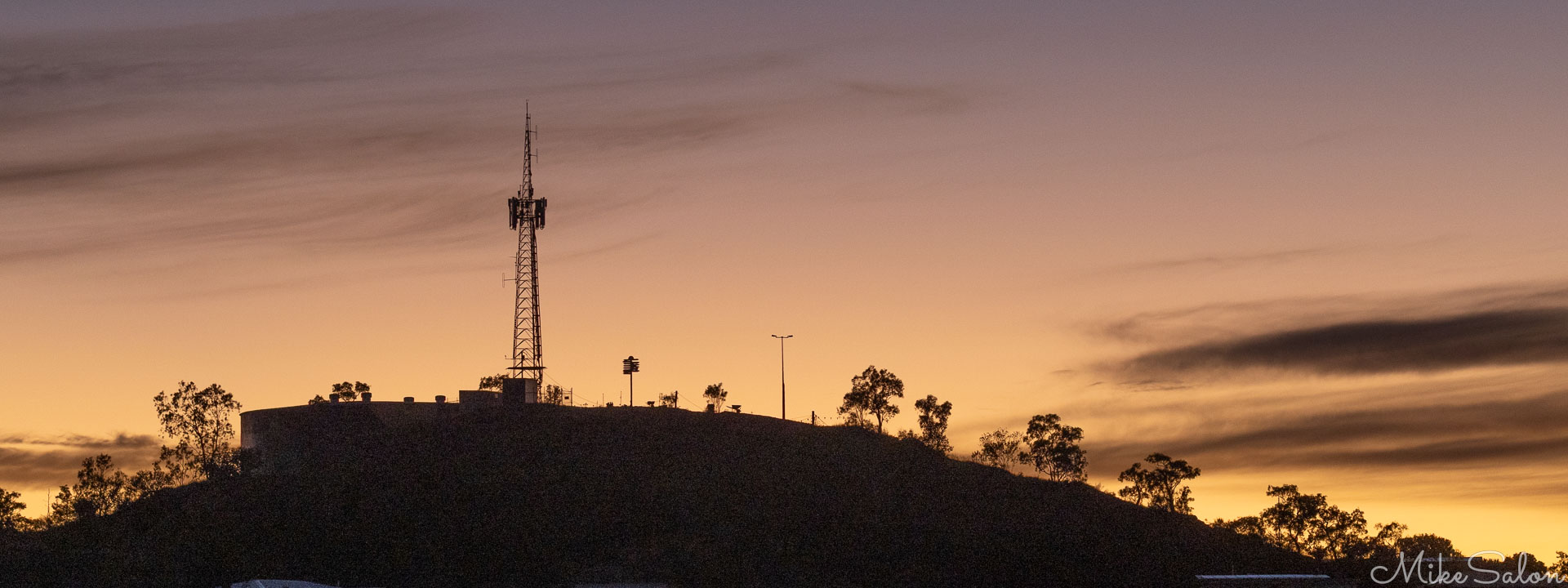 Dawn's first light from behind Mt Isa Lookout. [6625]