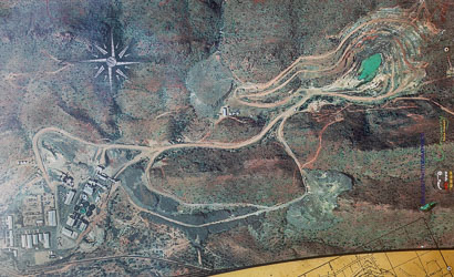 This map of Mary Kathleen mine was on a noticeboard near the old township. We did not see any trace of the processing plant to the left. No doubt the meandering track to the pit avoided it.  [0905]
