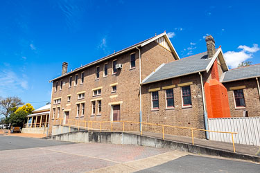 Mike recalls the Muswellbrook Railway Station from his short time as a Primary Schoolboy in the town. The original station is far left. Upstairs in the bigger building were sleeping quarters for railway engineers. [5578]