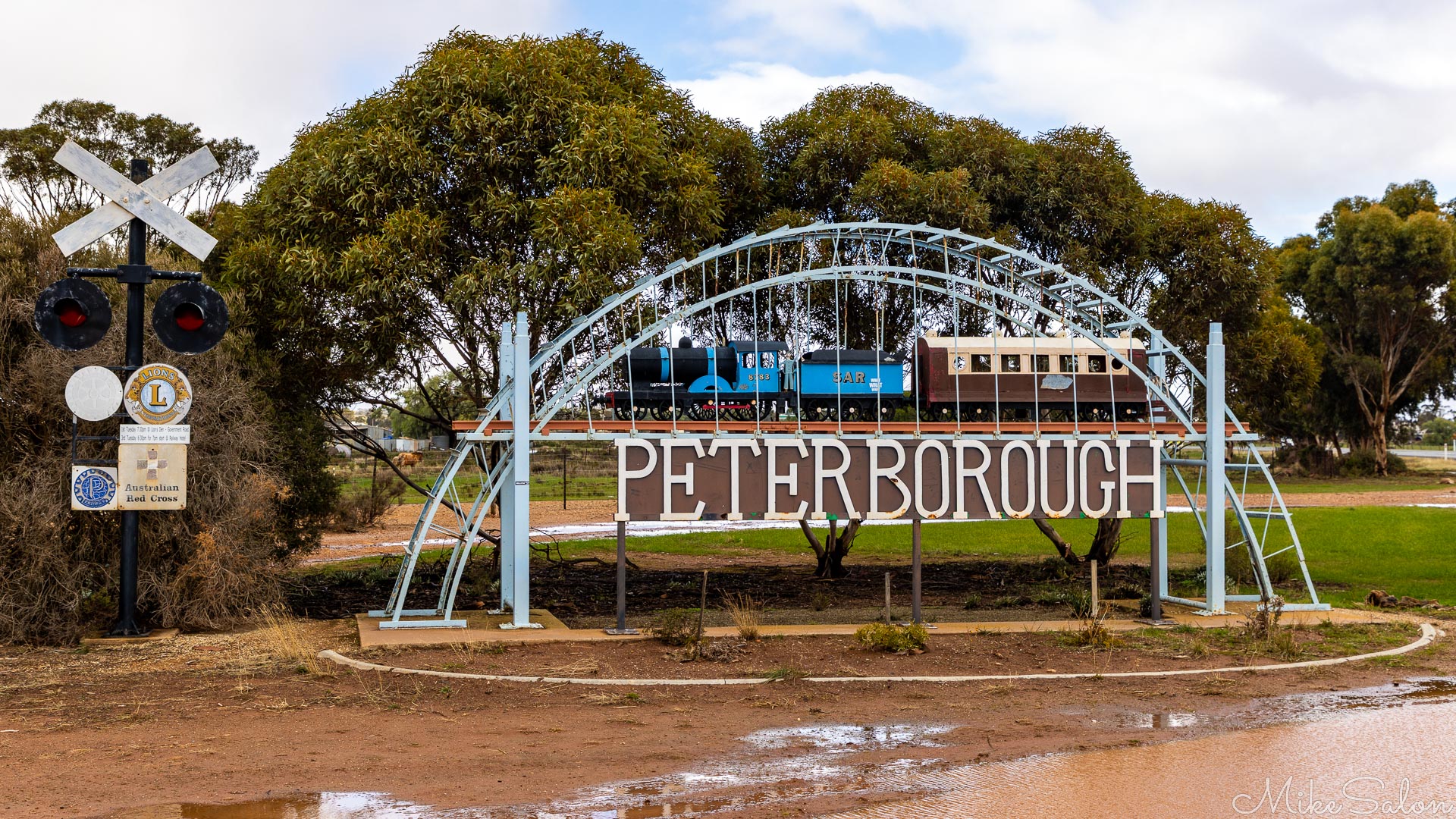 In a soggy park, one of a number of impressive welcome signs to Peterborough highlighting the town`s railway heritage. [3158]