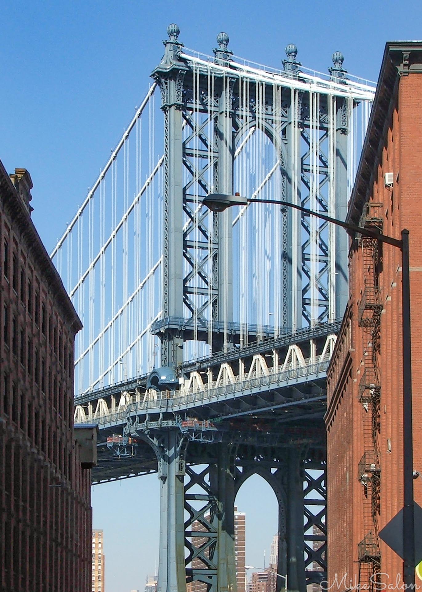 Manhattan Bridge from Brooklyn : One of four suspension bridges across NYC's East River, this one opened in 1909 and is thought of as the forerunner of modern suspension bridge design. (DSCF6118.jpg)<br>Camera: FinePix S5500