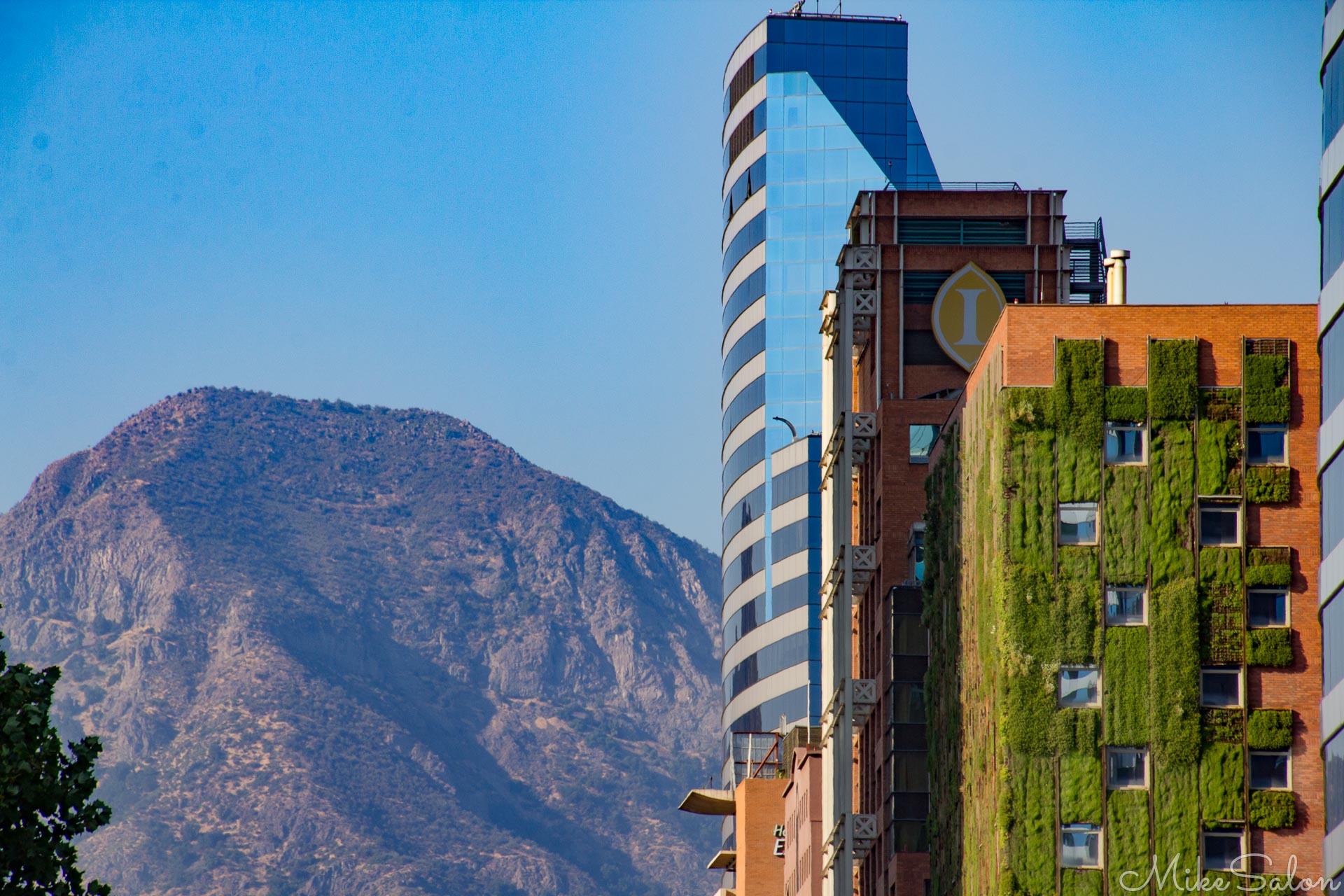 Modern City in Chile : Modern buildings in Av Vitacura, Santiago are dwarfed by surrounding mountains. (IMG_6329.jpg)<br>Camera: Canon EOS 60D