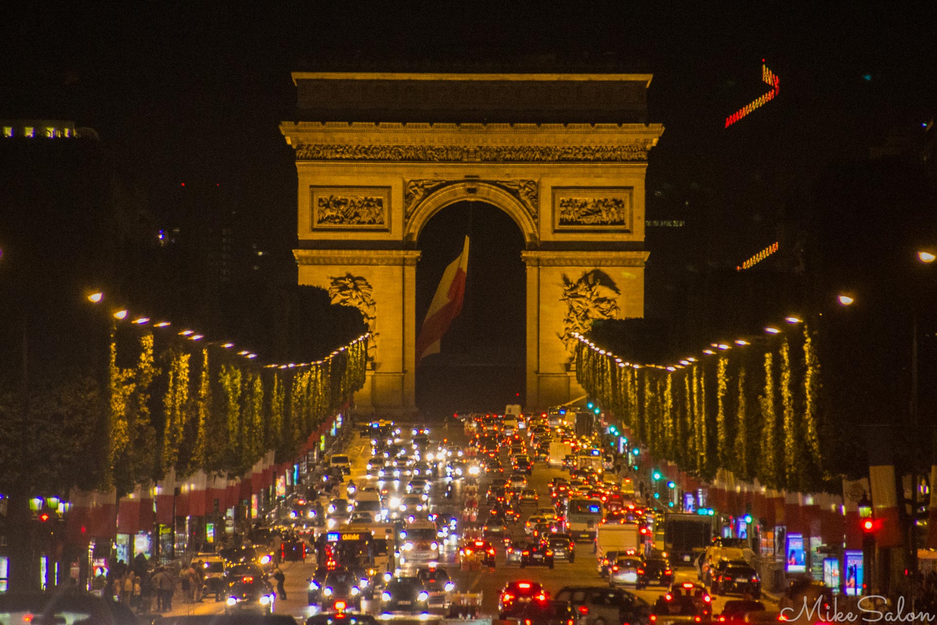 2:00am Arc de Triomphe : Heavy traffic on the Avenue des Champs Elysees after Bastille Day celebrations. (IMG_2980.jpg)<br>Camera: Canon EOS 60D
