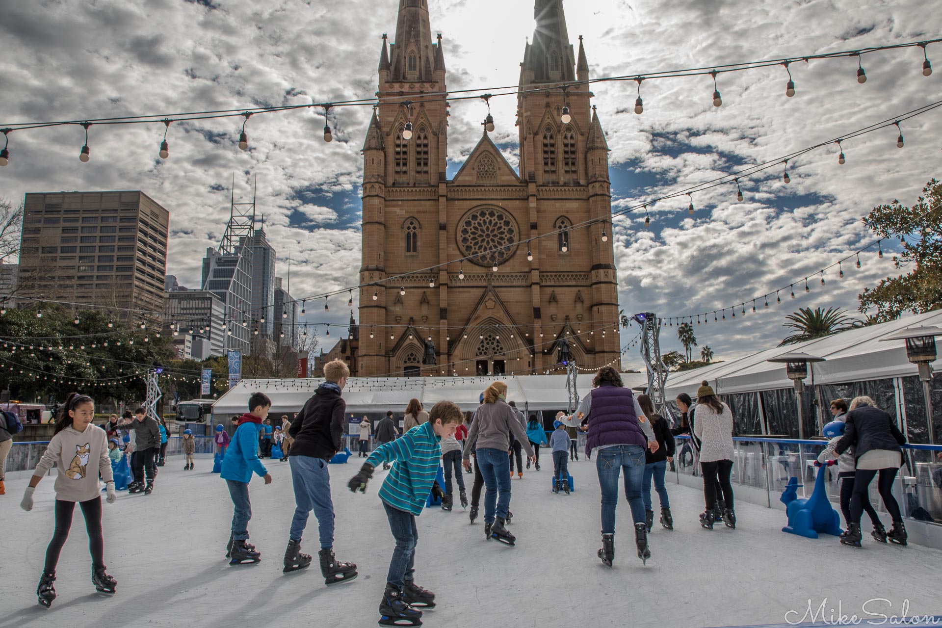 Skating before St Mary's Cathedral : Winter brings ice-skating to the roof of the Cook and Phillip Park olympic pool. (0D0A1301.jpg)<br>Camera: Canon EOS 5D Mark IV